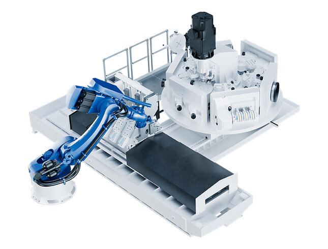 Ein Roboterarm von GROB positioniert einen Zylinderblock auf einer hochmodernen Bearbeitungsstation.